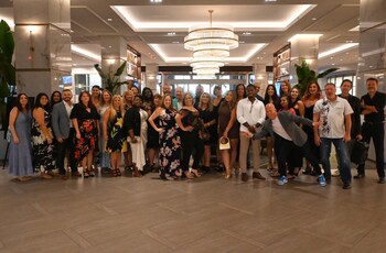 Aqua Home Care leadership and team members celebrate achieving statewide coverage across all 11 AHCA regions in Florida.