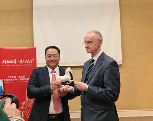 Photo shows Fang Junqin, Party Chief of Dehua County in southeast China's Fujian Province, presenting Dehua white porcelain to international guests in Geneva, Switzerland, on Feb. 24, 2026. Photo shows Fang Junqin, Party Chief of Dehua County in southeast China's Fujian Province, presenting Dehua white porcelain to international guests in Geneva, Switzerland, on Feb. 24, 2026.