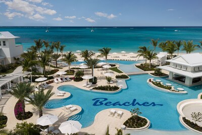 At Beaches Turks and Caicos, a 15,000-square-foot pool winds through Treasure Beach Village toward the beach, framed by whirlpools, tucked-away coves with lounge seating, and shallow play areas for little ones.