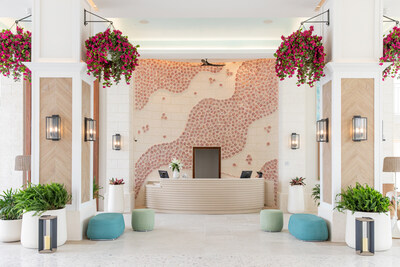 The lobby at Treasure Beach Village features a sculptural conch installation by local artisan Stanford Handfield, known as the TCI Shellman.