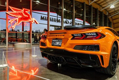 A sample version of the approved design for LeMay – America's Car Museum's custom license plate on an orange C8 Corvette. The LeMay plate is now available in the state of Washington through the DOL.