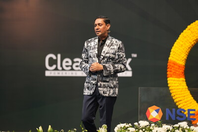 Kuldeep Jain, Managing Director of CleanMax, wearing a jacket with pictures of his 600 employees, at NSE bell ringing ceremony, during the company's Listing.