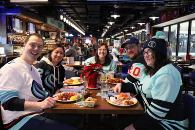 Fans enjoy a Pucks & Pancakes event at Kraken Community Iceplex restaurant, 32 Bar & Grill.