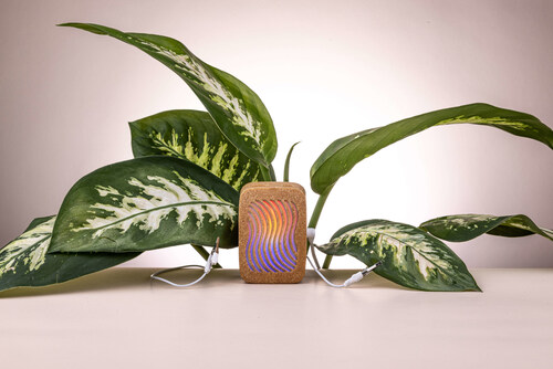 PlantWave plant music device connected to a houseplant, translating plant electrical signals into real-time music through bio-sonification technology.