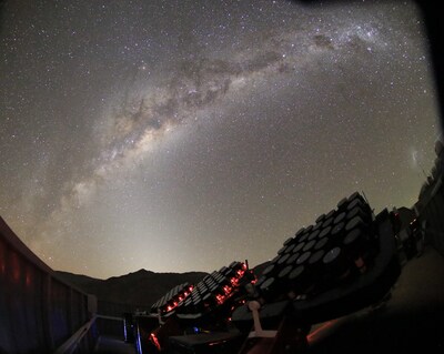 Partially completed MOTHRA array observing under the Milky Way at El Sauce Observatory in Chile. Several mounts of the telescope are visible as they take data beneath one of the darkest skies on Earth. Partially completed MOTHRA array observing under the Milky Way at El Sauce Observatory in Chile. Several mounts of the telescope are visible as they take data beneath one of the darkest skies on Earth.