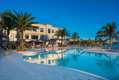 Guests enjoy the outdoor pool overlooking the Gordon River at Hyatt House Naples/Fifth Avenue.