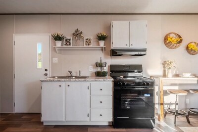 TRU Buttercup's kitchen features Frigidiare® appliances, DuraCraft® cabinets and modern rolled-edge countertops.