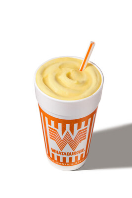 Whataburger Banana Pudding Shake in a branded orange-and-white cup with a straw, topped with a smooth, creamy swirl.