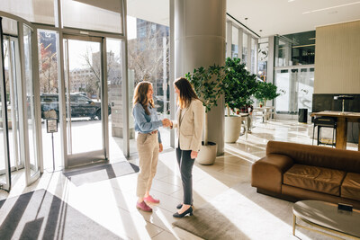 Amber Spackman greets Mayor Mendenhall.