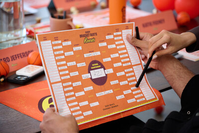 Richard Jefferson and Katie Feeney finalize their tournament picks during the Reese's Summit for 