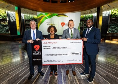 David Hoenemeyer, COO of Seminole Gaming, alongside the honorable Minister of Culture, Gender, Entertainment and Sport Olivia Grange and Jamaica’s Consul General to Miami Oliver Mair, presents the ceremonial check on behalf of the Hard Rock Heals Foundation to Chris Benjamin, Board Member and Director of Jamaica's Promise.