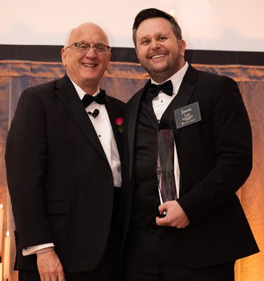 Jason Last, executive director of Benchmark Senior Living at Forge Hill, accepts the 2025 Be the Benchmark award