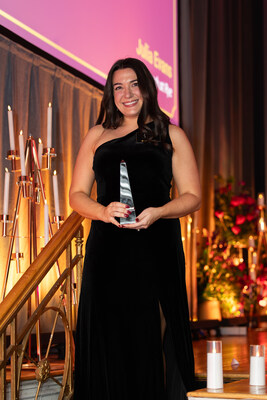Julia Evans, programming director at Benchmark at Rye, accepts the 2025 Better Together Award