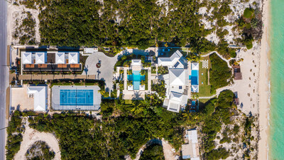 This bird’s eye view of the main, seaward portion of Triton shows the main residence (right-of-center), each of its resort-style pools (immediate left and right of residence), bocce ball court (beneath front pool, on left), regulation tennis court, staff quarters (left of court) and bungalow suites (above-left of court). The separate sports complex is not pictured. TritonLuxuryAuction.com.