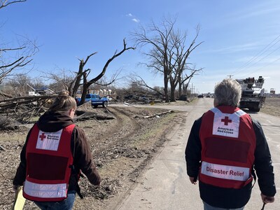 American Red Cross disaster relief volunteers Shanelle McKinney and Jerry Yothment respond to a neighborhood in Lake Village, Indiana, struck by tornadoes in March. Photo by Janie Bohlmann/American Red Cross.