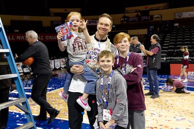 FHU Head Coach Drew Stutts and his children celebrate the team's NAIA National Championship win Tuesday, March 24, 2026, in Kansas City, Missouri.