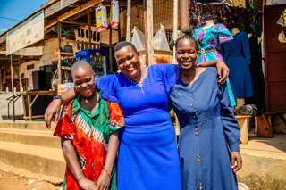Photo credit: Muthoni Njuki  Caption: Betty (middle), a fistula survivor from Uganda, was treated by Fistula Foundation and received skills training to learn how to sew.