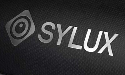 The SYLUX logo, representing Compal’s automotive infrared technology organization, is presented against a dark textured background, reflecting its professional and technological identity. The SYLUX logo, representing Compal’s automotive infrared technology organization, is presented against a dark textured background, reflecting its professional and technological identity.
