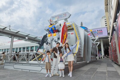 A 5 metre tall RX-78-2 Gundam in a dynamic launch pose anchors the Gundam experience at Harbour City’s Ocean Terminal Forecourt, overlooking Victoria Harbour.