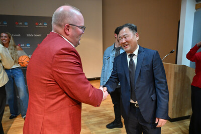 Don Kwack, President and CEO of LG Electronics North America, congratulates Luke Bosso, Director of Athletics at IU Indianapolis, following LG's $10,000 donation to support student-athlete mental health resources at the 2026 NCAA Men's Final Four. Pictured (from l to r): Luke Bosso; Don Kwack.