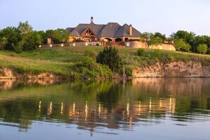 For sale: One of Texas' most over-the-top ranches, with decadent main home, sports building, event venue, horse barn, lakeside cabin and field with nothing but sunflowers