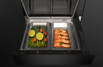 The new Miele steam drawer, when combined with a 45 cm compact oven with microwave in a 60 cm niche, forms a space-saving 3-in-1 solution for baking, reheating and steam cooking, with two separate steam cooking containers for preparing different food at the same time. Coming March 2027. (Photo: Miele)