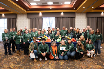 Atrium Hospitality leaders participate in the School Supply Stampede, packing 1,000 backpacks for the Samaritan Community Center during the 2026 SPIRIT Leadership Conference.