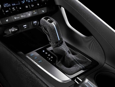 Hyundai N Performance Parts (Elantra N Alcantara® AT gear shift knob and shifter boot) are depicted. Hyundai N Performance Parts (Elantra N Alcantara® AT gear shift knob and shifter boot) are depicted.