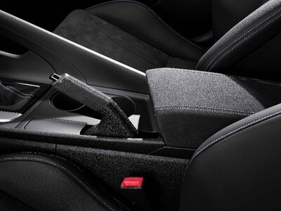 Hyundai N Performance Parts (Elantra N Alcantara® handbrake and console cover) are depicted. Hyundai N Performance Parts (Elantra N Alcantara® handbrake and console cover) are depicted.