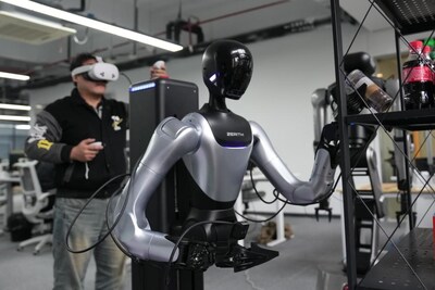 A technician debugs a humanoid robot at a company in Ningbo, east China's Zhejiang Province, March 26, 2026. (Xinhua/Huang Zongzhi)