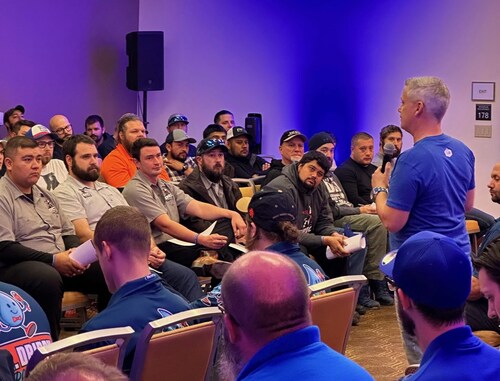 Chris French (right), founder and CEO of The Plumbing Sales Coach, leads a recent training session with plumbing professionals. The company has announced the launch of its new Blueprint program to help businesses improve performance, consistency and customer service.