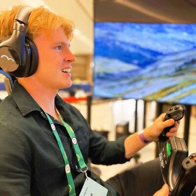 A visitor engages with a ROF™ immersive flight simulator during a live event. RoarFun™ provides compact, high-impact flight simulator rental solutions designed for high-traffic public activations, enabling brands and tourism boards to drive engagement and visitor interaction.