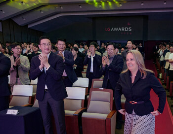 LG Corp. CEO and Chairman Kwang Mo Koo (left) congratulates Penny Butler, Senior Director at AVEO, the first international employee to win in the individual category of the 'Customer Impression Grand Award' at the LG Awards.