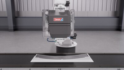 The adhesive solution is not only applied precisely to the display assembly, but also enables quick adjustments and repairs throughout the entire lifecycle thanks to its removable bonding capability. (PRNewsfoto/tesa SE)