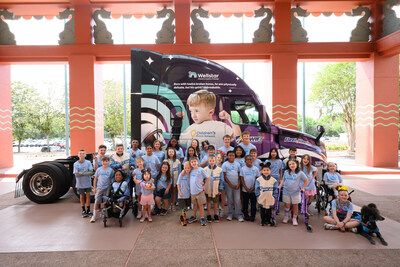 Children's Miracle Network 2026 Champions with Knight-Swift truck featuring Coale, a 2025 CMN Champion.