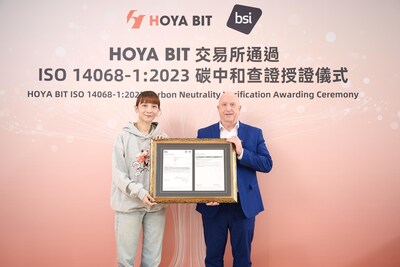 HOYA BIT Founder and Chairperson Zoe Peng (Left) and the Vice President of  BSI Bryn Sutton (Right) at the HOYA BIT 2026 carbon neutrality certification  ISO 14068-1 awarding ceremony.