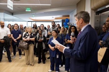 Dr. James Olfson shares remarks during the ribbon‑cutting ceremony.