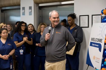 Dr. Mike Uselton shares remarks during the ribbon‑cutting ceremony.