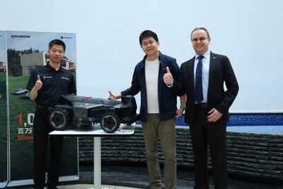 Ceremony moment – from left to right: Calvin Chen (President and CTO, Segway Navimow), George Ren (CEO, Segway Navimow), and Frank Holzmann (Global Vice President of TÜV Rheinland Business Field Electrical) with the 1,000,000th Navimow robotic lawnmower.
