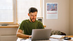 A man reviews financial literacy content from Accredited Debt Relief and plans a "debt reset day" as part of a new campaign for financial literacy month.