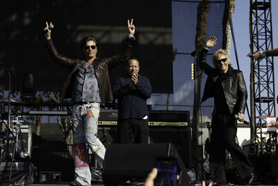 Brandon Ramirez, director, corporate social responsibility, Hyundai Motor North America, John Stamos, mentor, Adopt the Arts, and Matt Sorum, cofounder, Adopt the Arts on stage at BeachLife Festival in Redondo Beach, Calif. on May 2, 2026