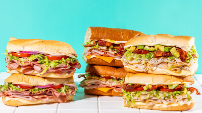 Schlotzsky’s Deli New Stacked Subs – featuring Zesty Italian, Honey Mustard Club, and Turkey Avocado BLT (shown left to right).
