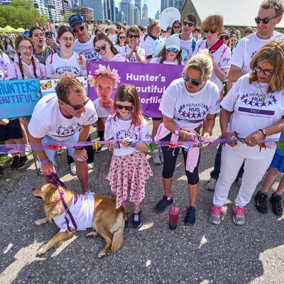 Kicking off the annual HUG event with an MBF Hero Ambassador cutting the ribbon in honour of her late sister. (CNW Group/Meagan Bebenek Foundation)