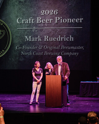 Mark Ruedrich, co-founder and president of North Coast Brewing Company, accepts the 2026 Craft Beer Pioneer Award alongside his wife, Merle, and NCBC CEO/CFO Jennifer Owen.