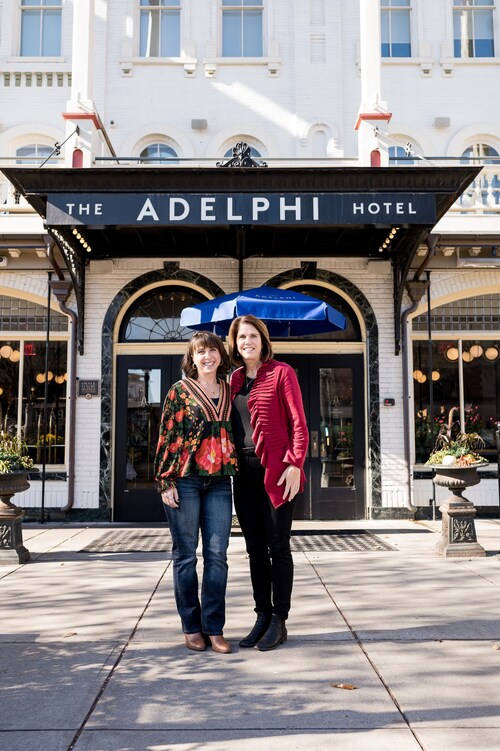 Alchemy Co-Founders Allie Wik and Sandy Sullivan in front of The Adelphi Hotel, Saratoga Springs, NY