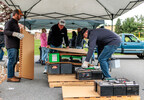 Volunteers from East Penn's Transportation Department help load returned batteries onto pallets.