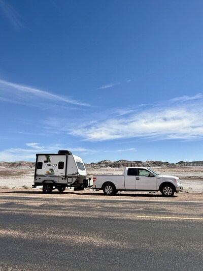 Truck towing an RV on Route 66 in Texas.