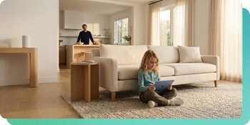 Parent watches as child uses ipad with music