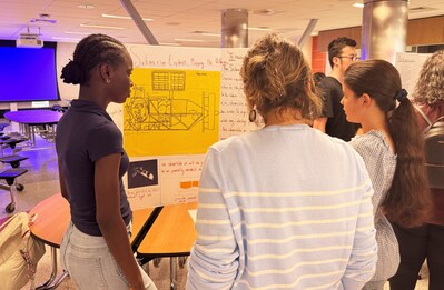Students learning at the Massachusetts Learning Blade celebration event.