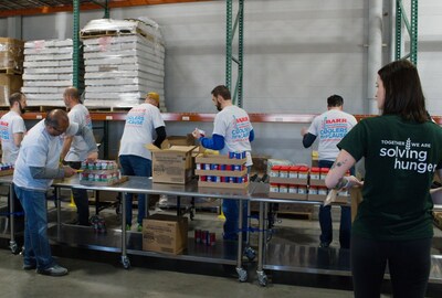 Barr Refrigeration employees work with Feeding America to pack boxes of food for senior citizens at Feeding America Eastern WI’s location in Appleton, WI. Barr Refrigeration employees work with Feeding America to pack boxes of food for senior citizens at Feeding America Eastern WI’s location in Appleton, WI.